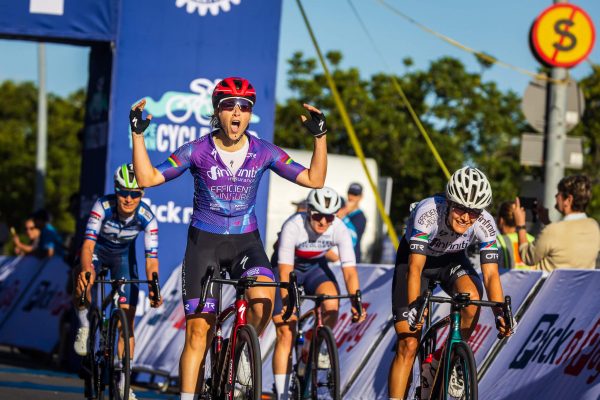 Cape Town Cycle Tour 2023 female cyclist celebrates crossing the finish line